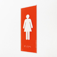 Plaque de porte rouge avec braille et pictogramme femme